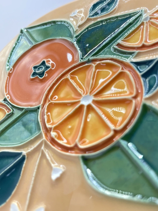 Ręcznie robiona podstawka ceramiczna z motywem pomarańczy